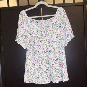 White top with small floral design